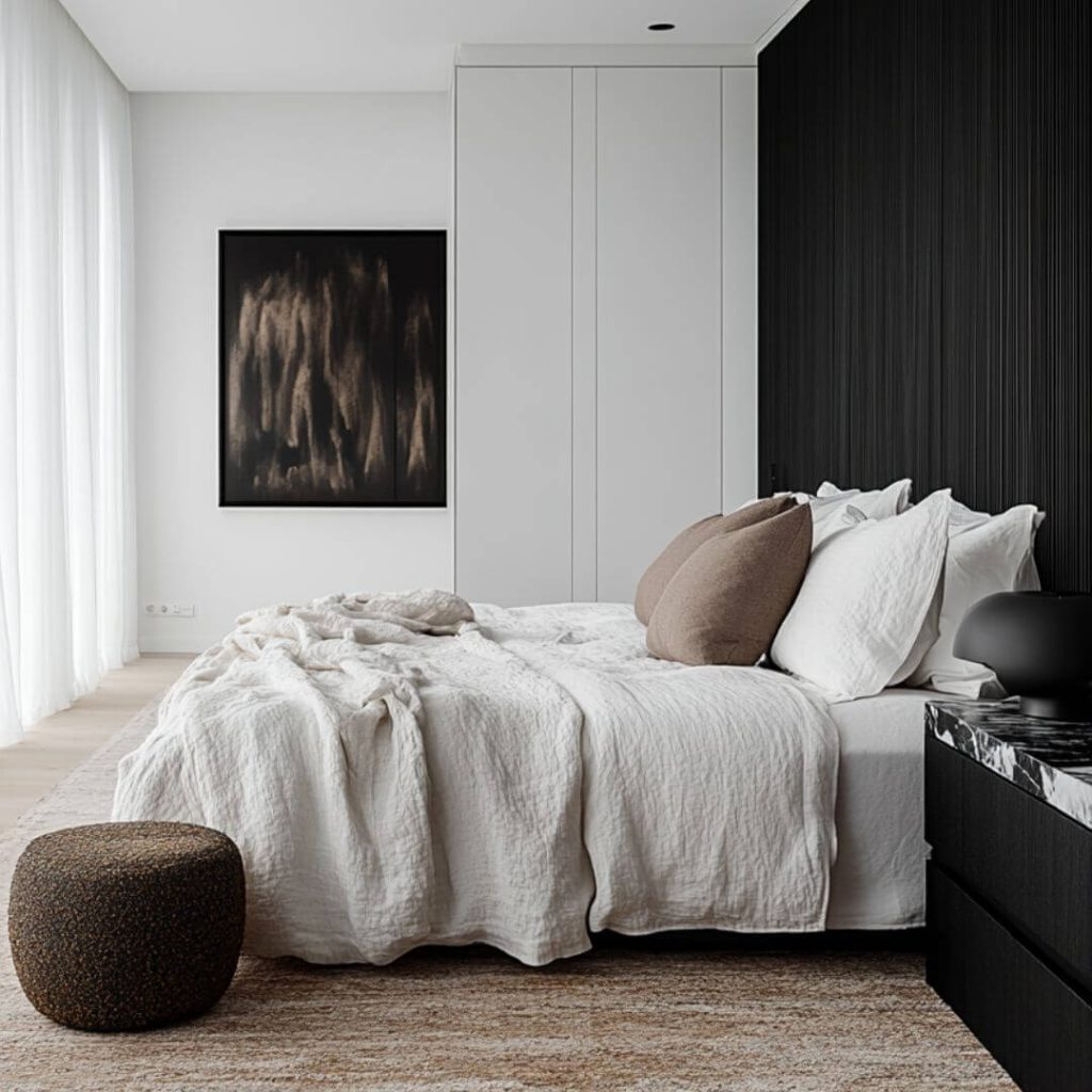 Diseño de dormitorio en blanco y negro con armario integrado y obra artística – interiorismo sobrio con carácter.
